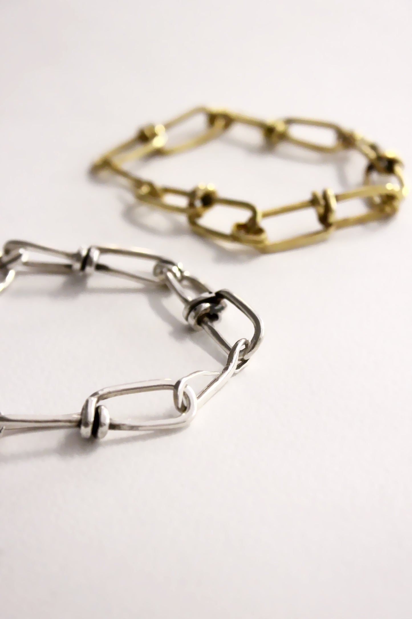 silver and gold chain bracelets