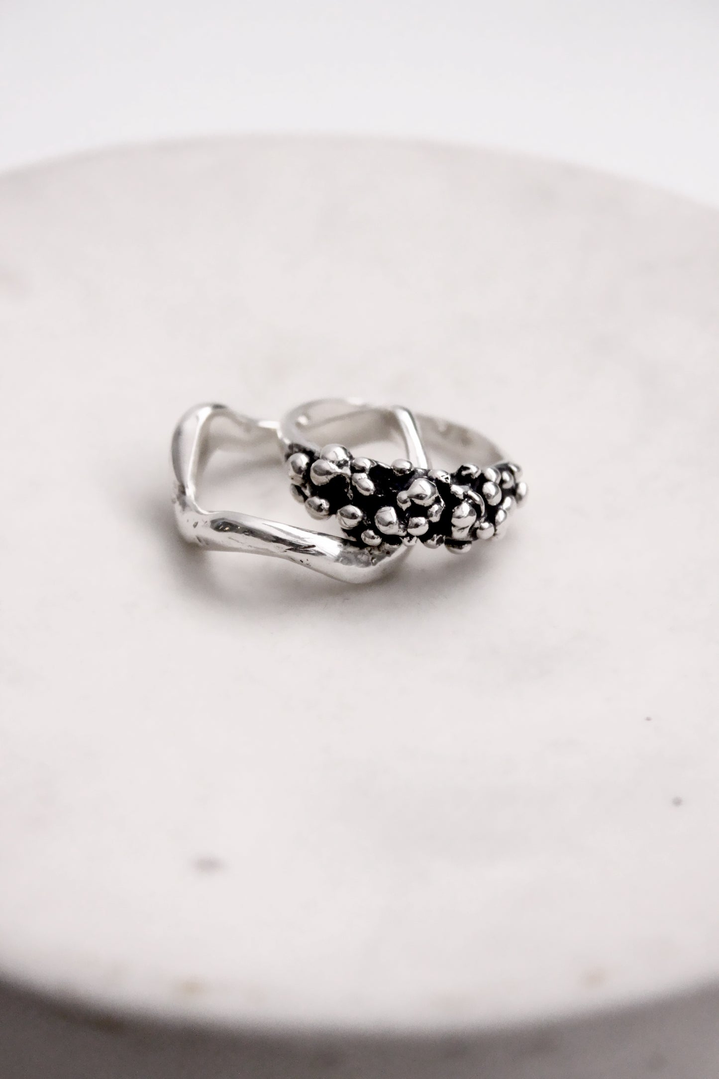 Silver ring with black beads 