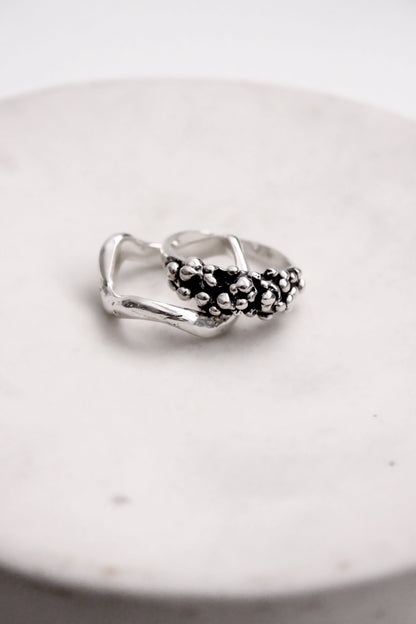 Silver ring with black beads 