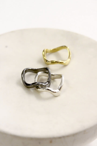 gold and silver wavy molten liquid  rings