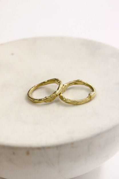 Two gold promise rings 
