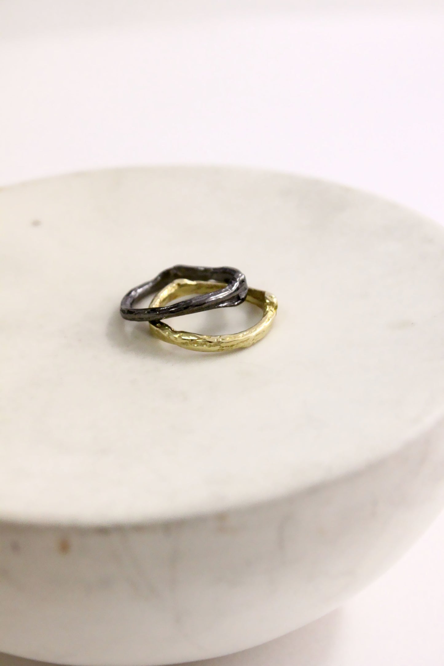 Two rings, one gold and one black
