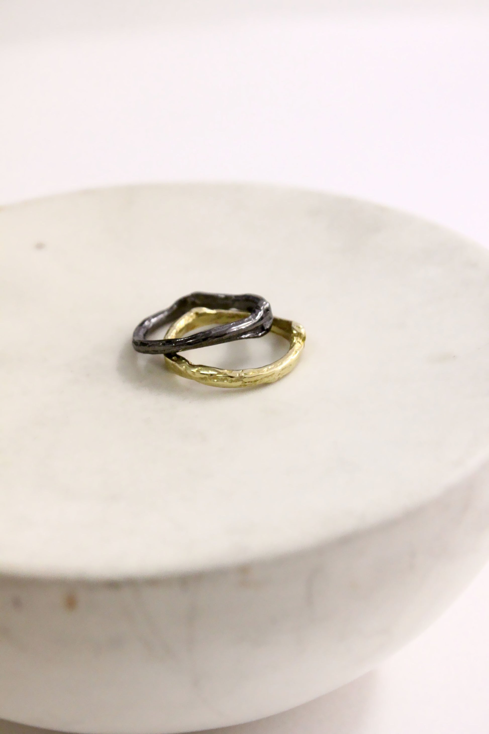 Two rings, one gold and one black