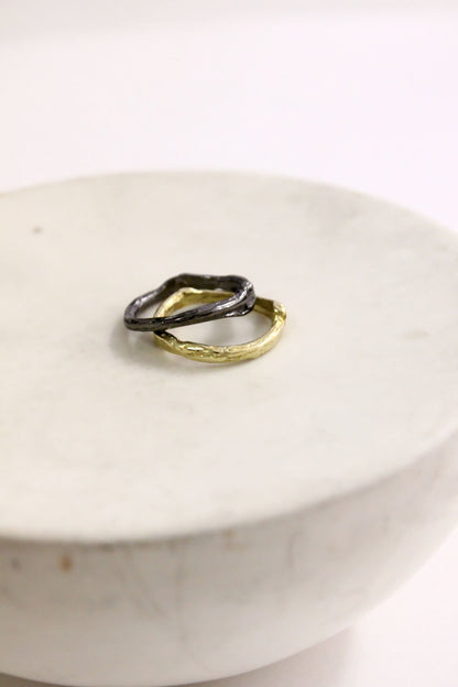 Two rings, one gold and one black