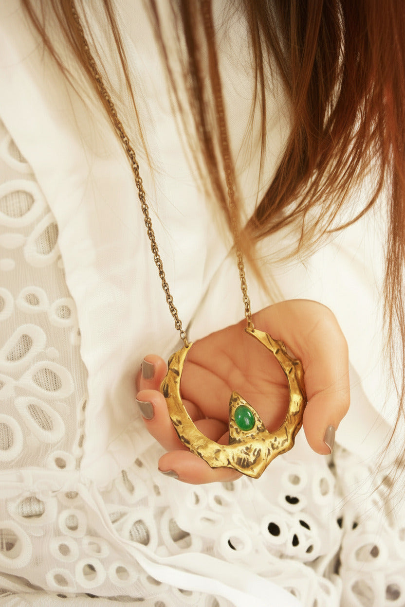 Gold necklace with a green onyx gemstone