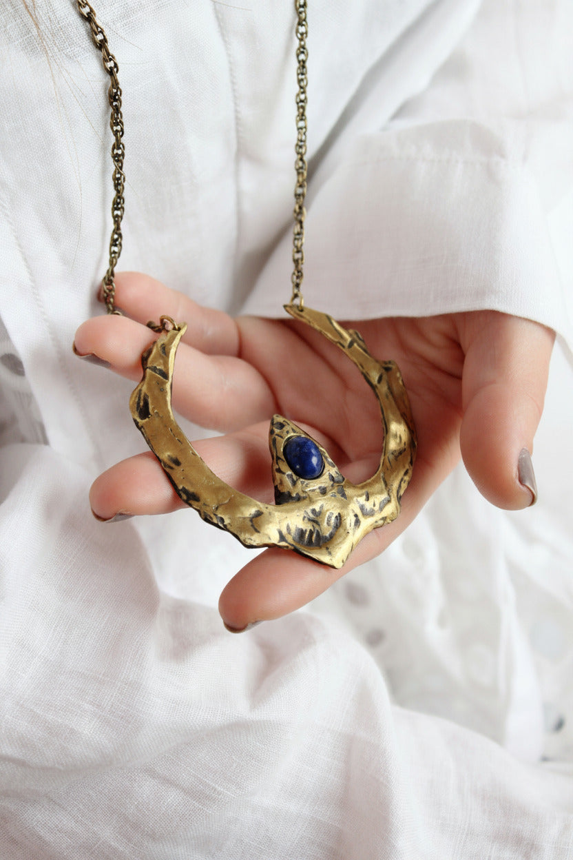 Gold necklace with a blue sodalite stone 