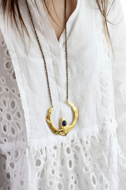 Gold necklace with a blue sodalite stone 