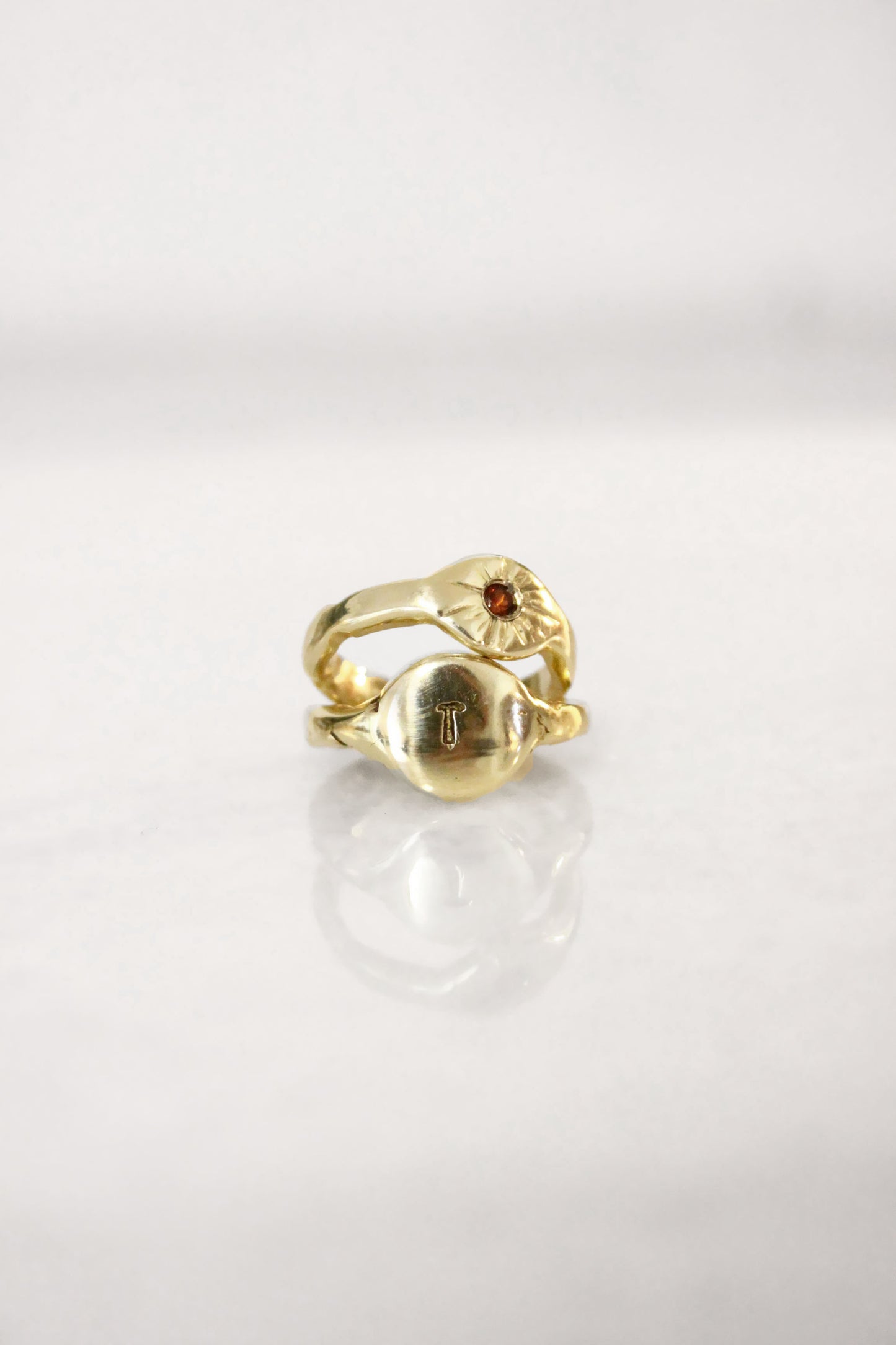 Gold ring with a red garnet gemstone 