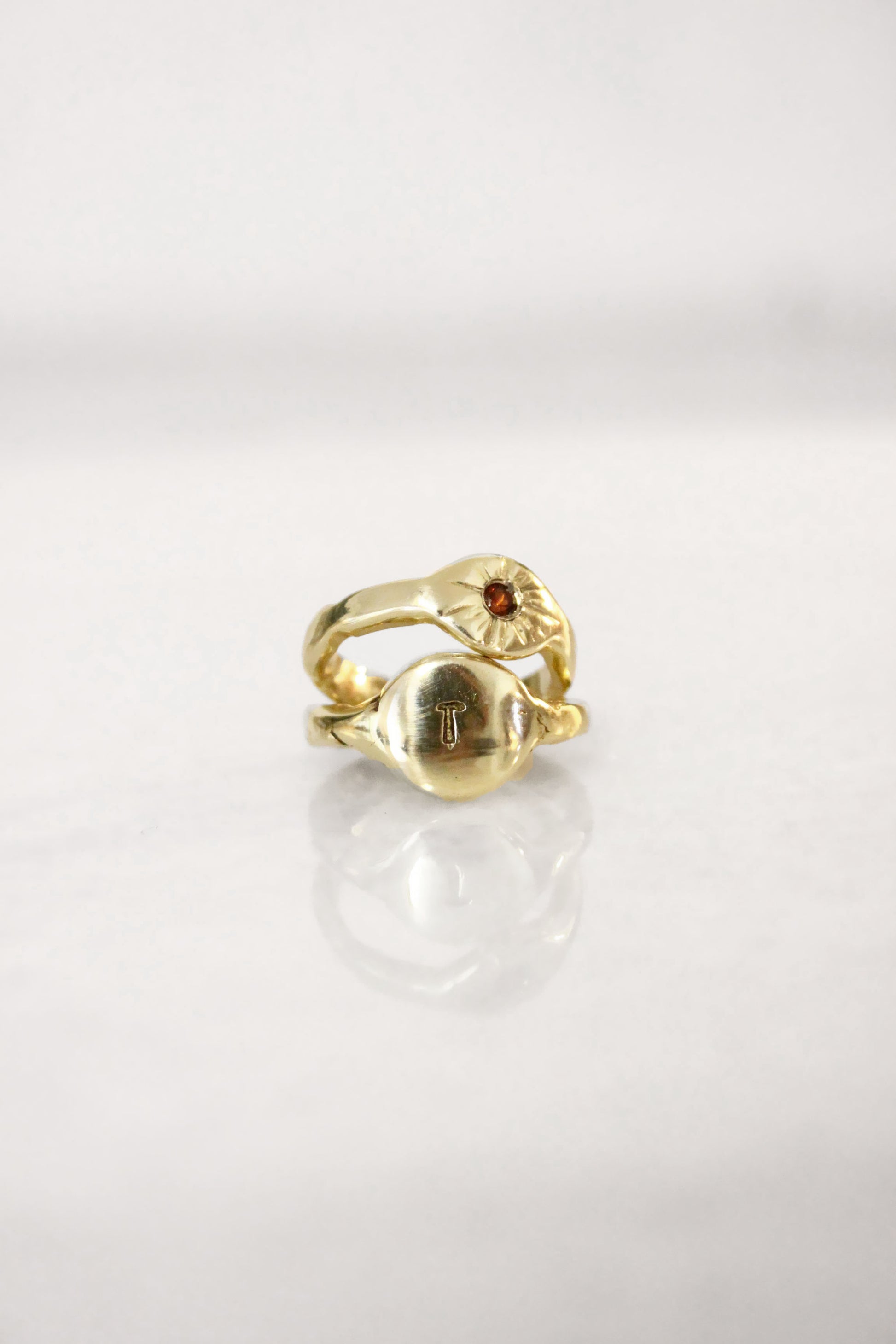 Gold ring with a red garnet gemstone 