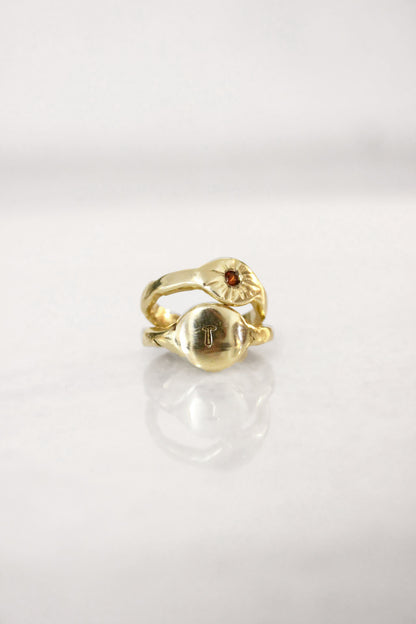 Gold ring with a red garnet gemstone 