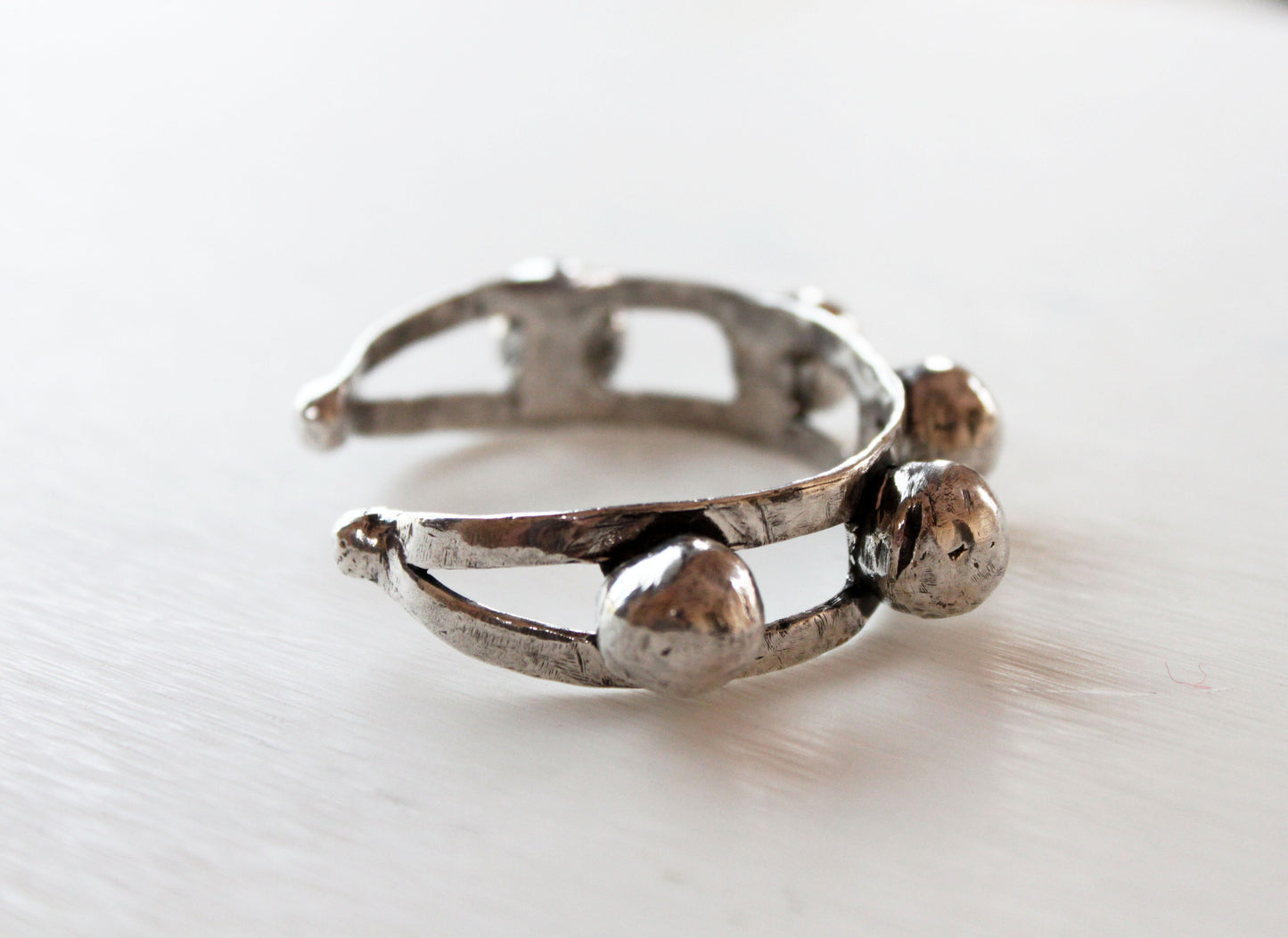 Silver cuff with a textured design