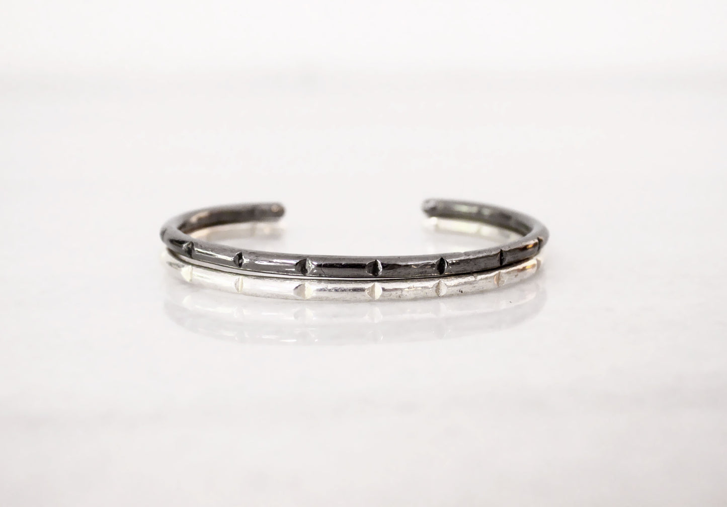 Silver bracelet with black accents 