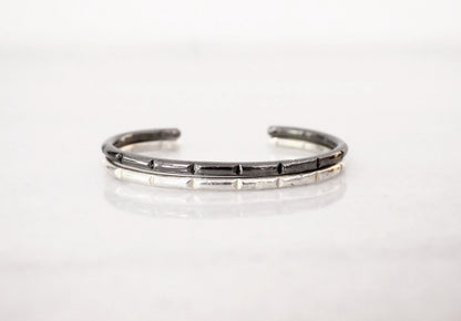 Silver bracelet with black accents 