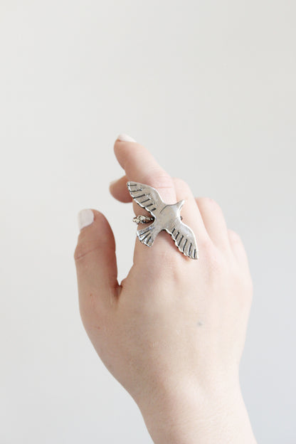 silver ring bird