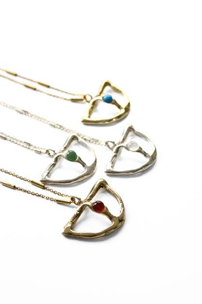 pendants on gold chains with gemstones 