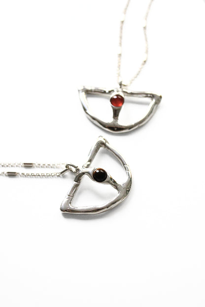 Two silver pendants with gemstones 