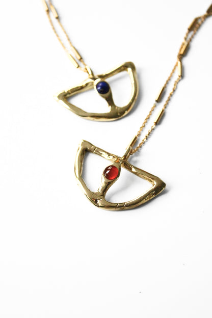 Two gold necklaces with gemstone pendants 