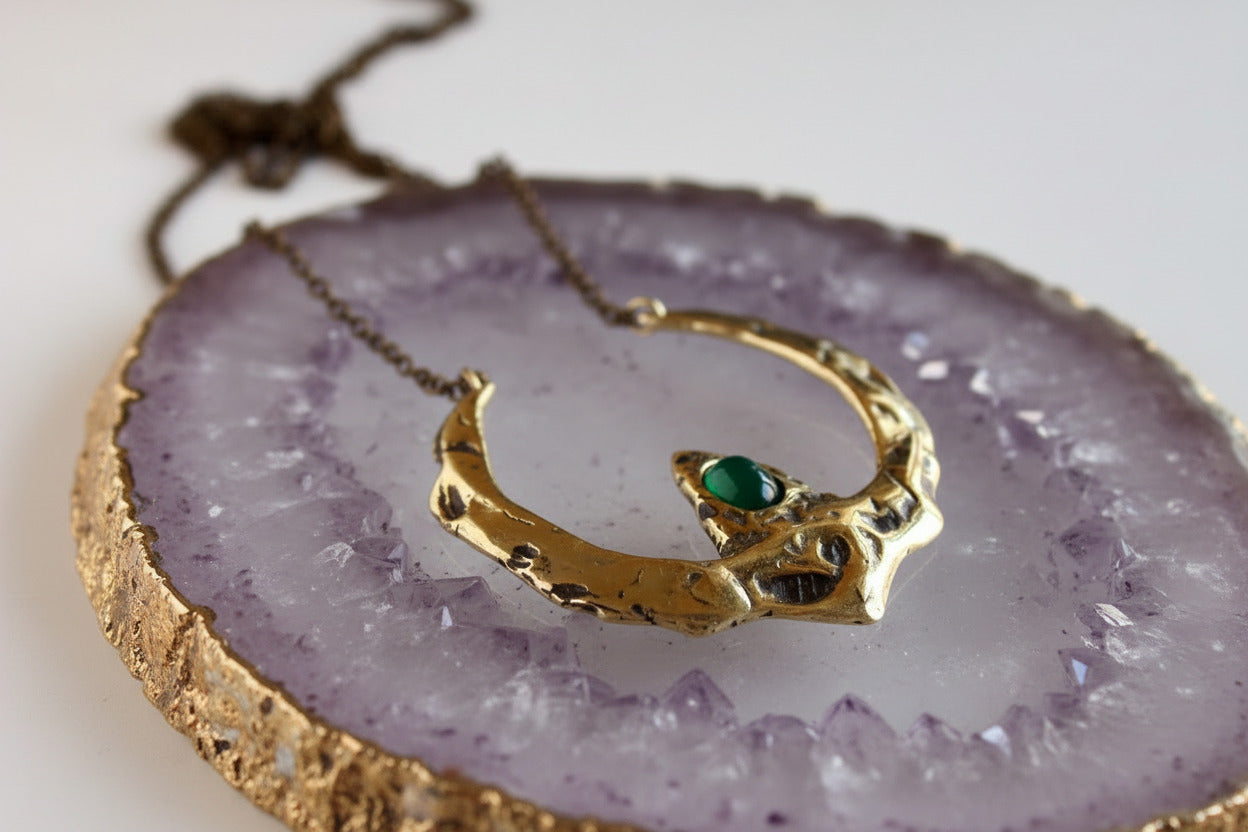 Gold necklace with a green onyx gemstone 