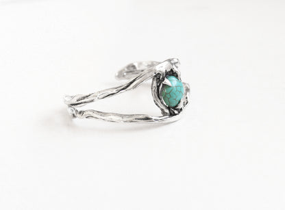 Silver witch bracelet with a turquoise crystal