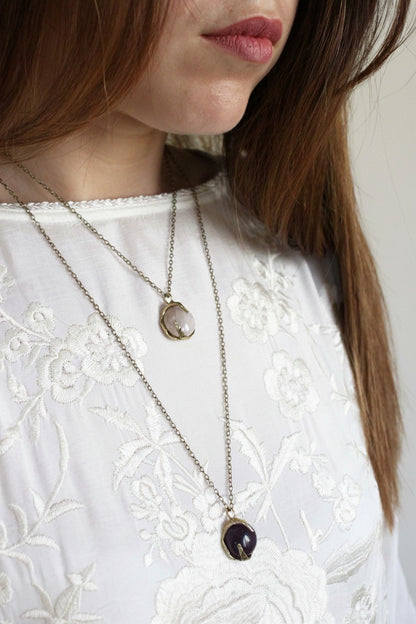 two necklaces with crystals stone