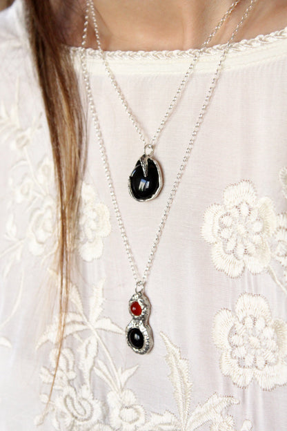 Necklaces with black and red gemstones