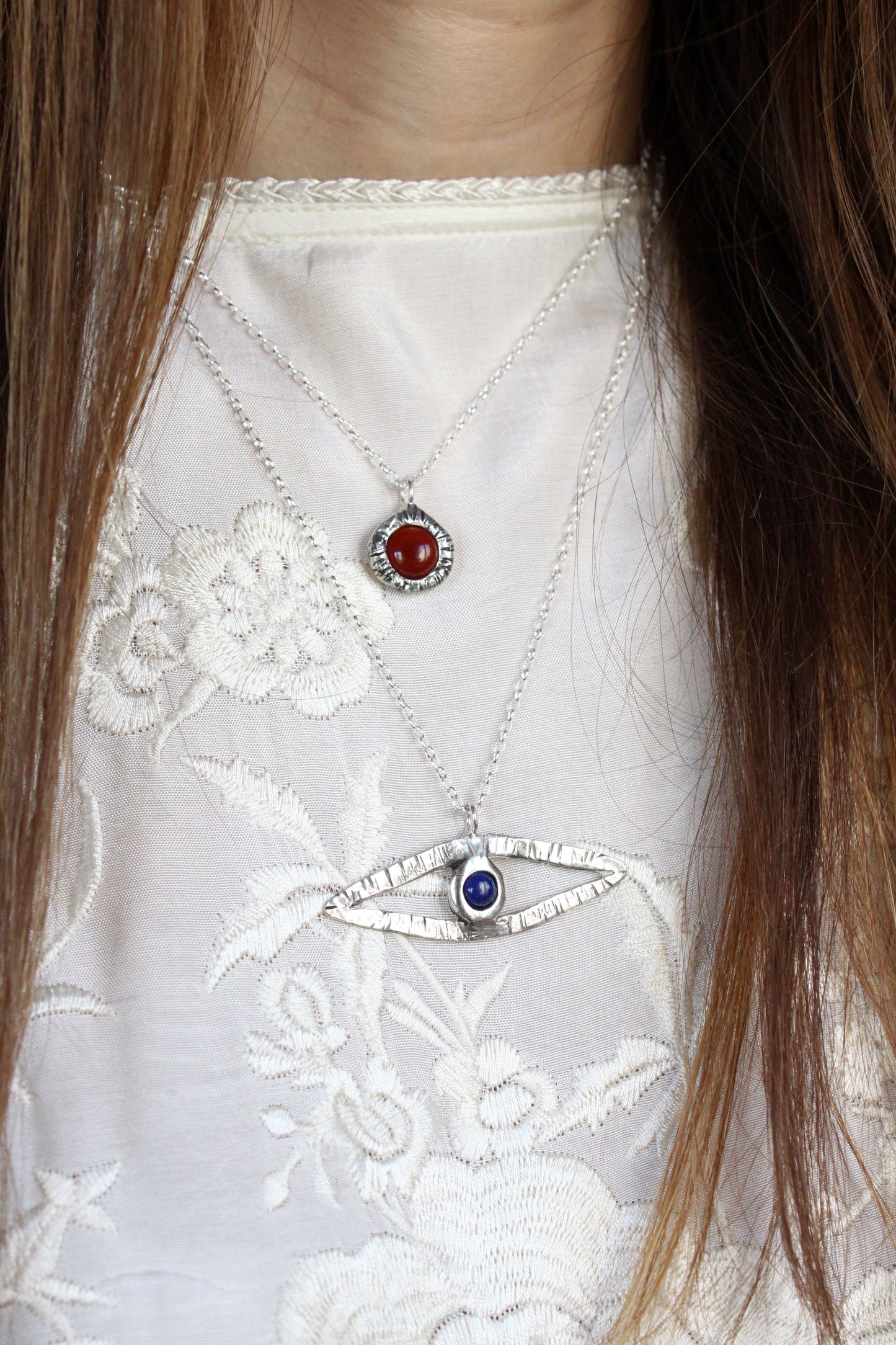 Necklaces with red and blue lapis lazuli gemstones 