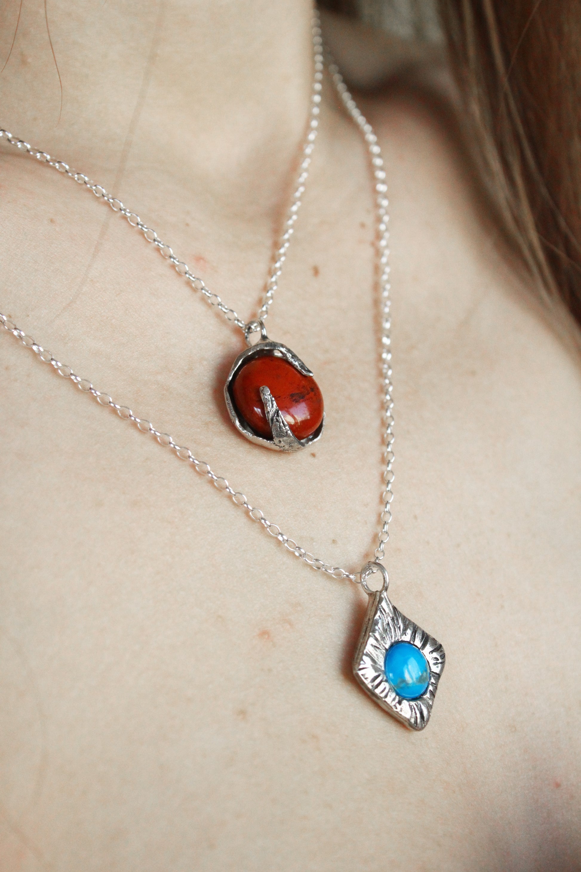 Two necklaces with turquoise and red jasper crystals