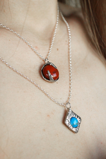 Two necklaces with turquoise and red jasper crystals