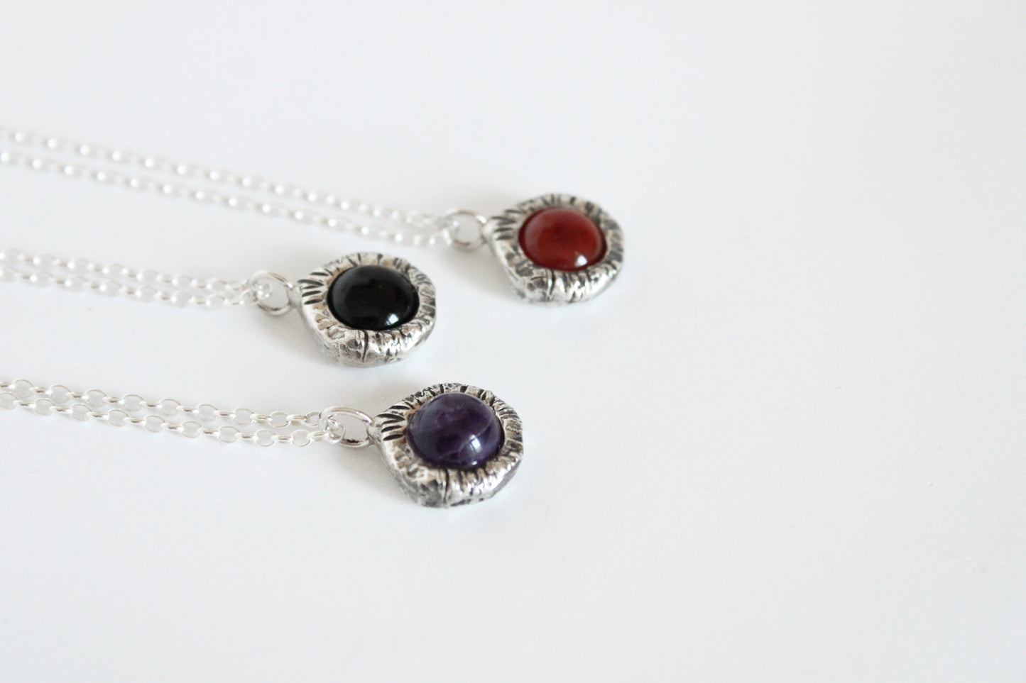 Silver necklaces with gemstone pendants