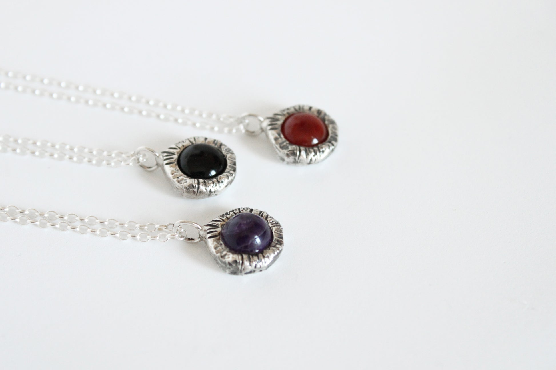 Silver necklaces with gemstone pendants