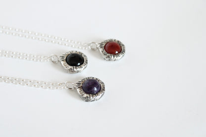 Silver necklaces with gemstone pendants