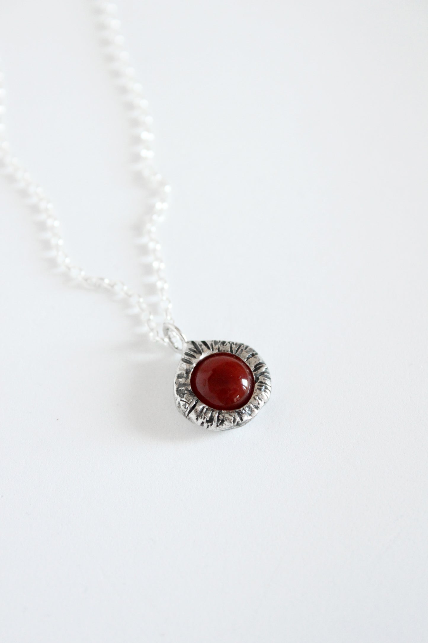 Necklace with a red carnelian pendant