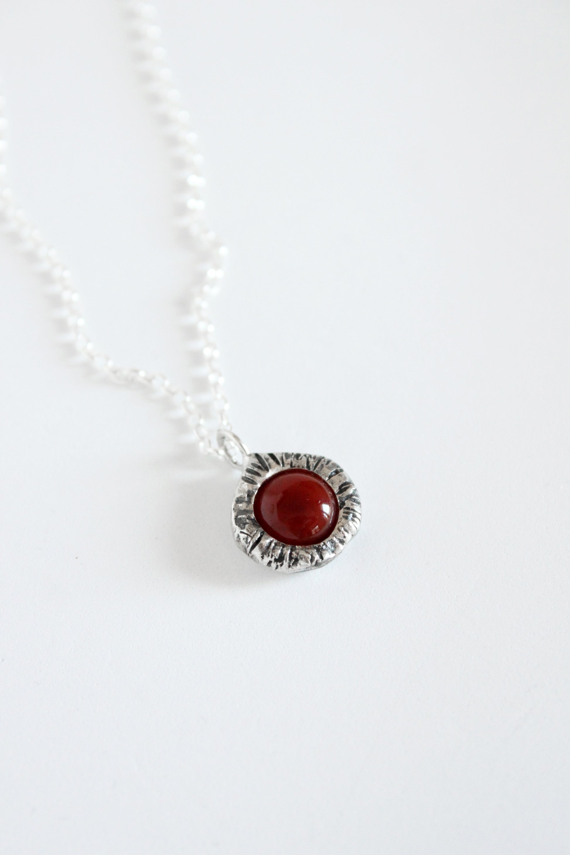 Necklace with a red carnelian pendant