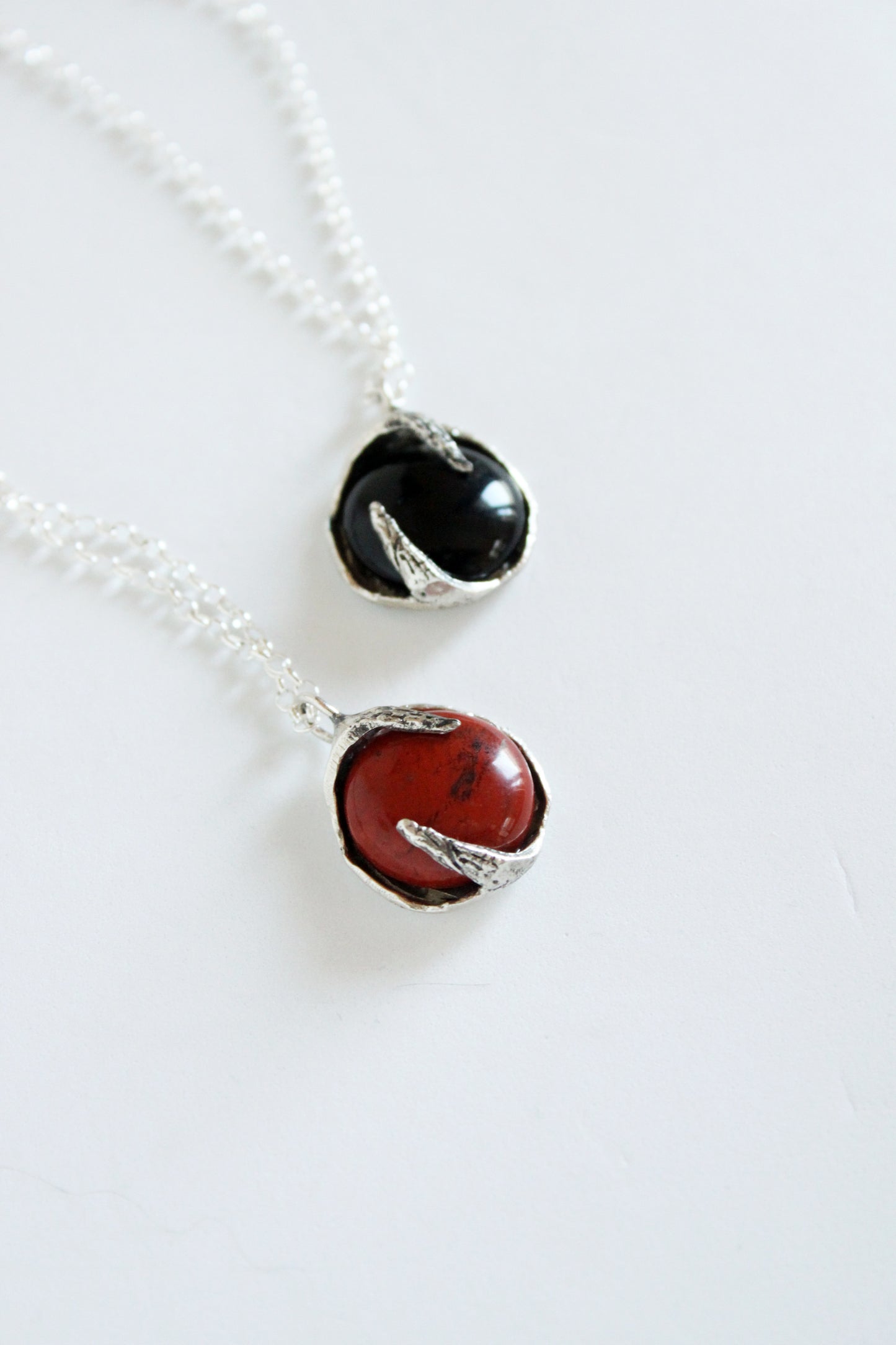 Two stone pendants with black onyx and red jasper