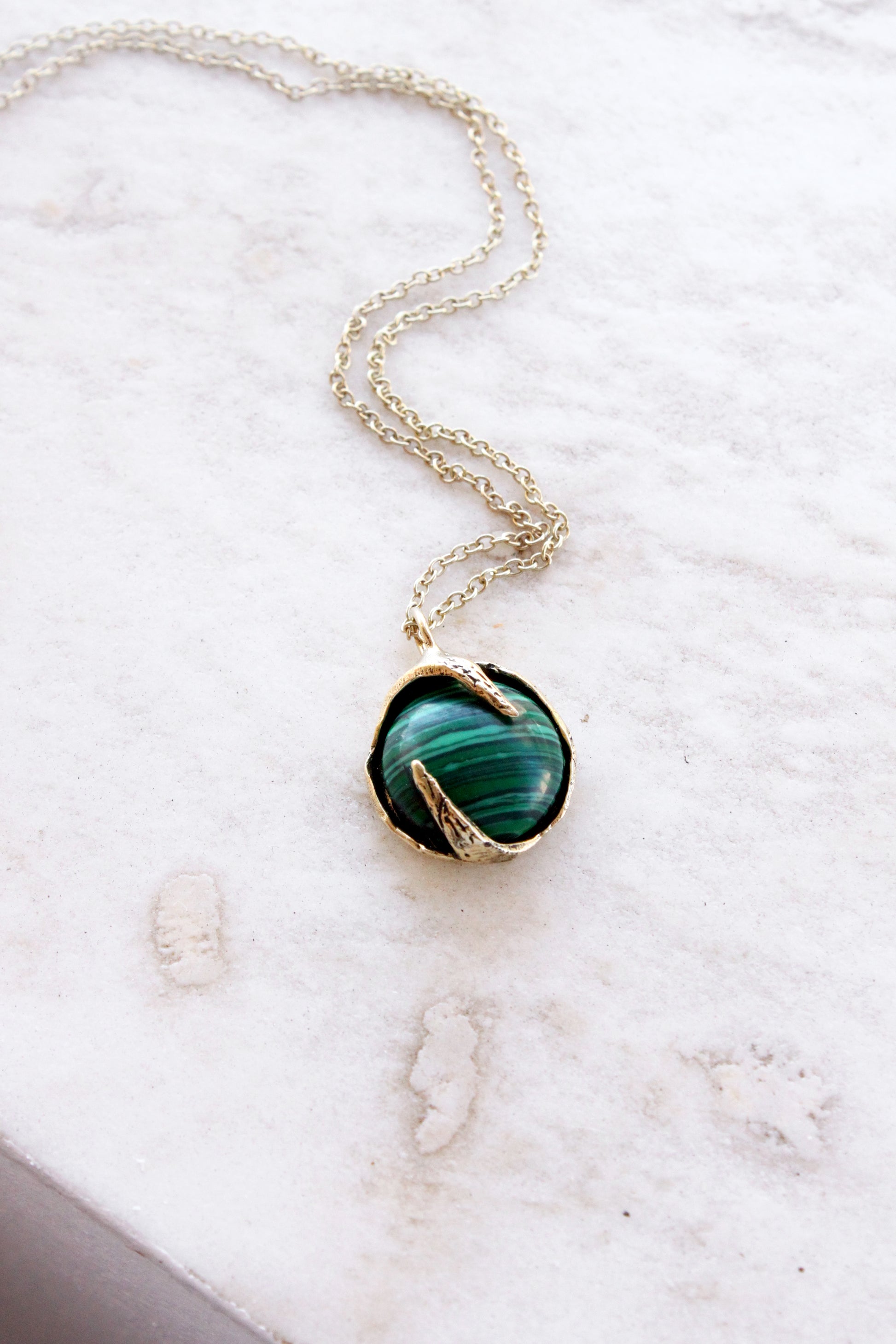Necklace with a green malachite crystal