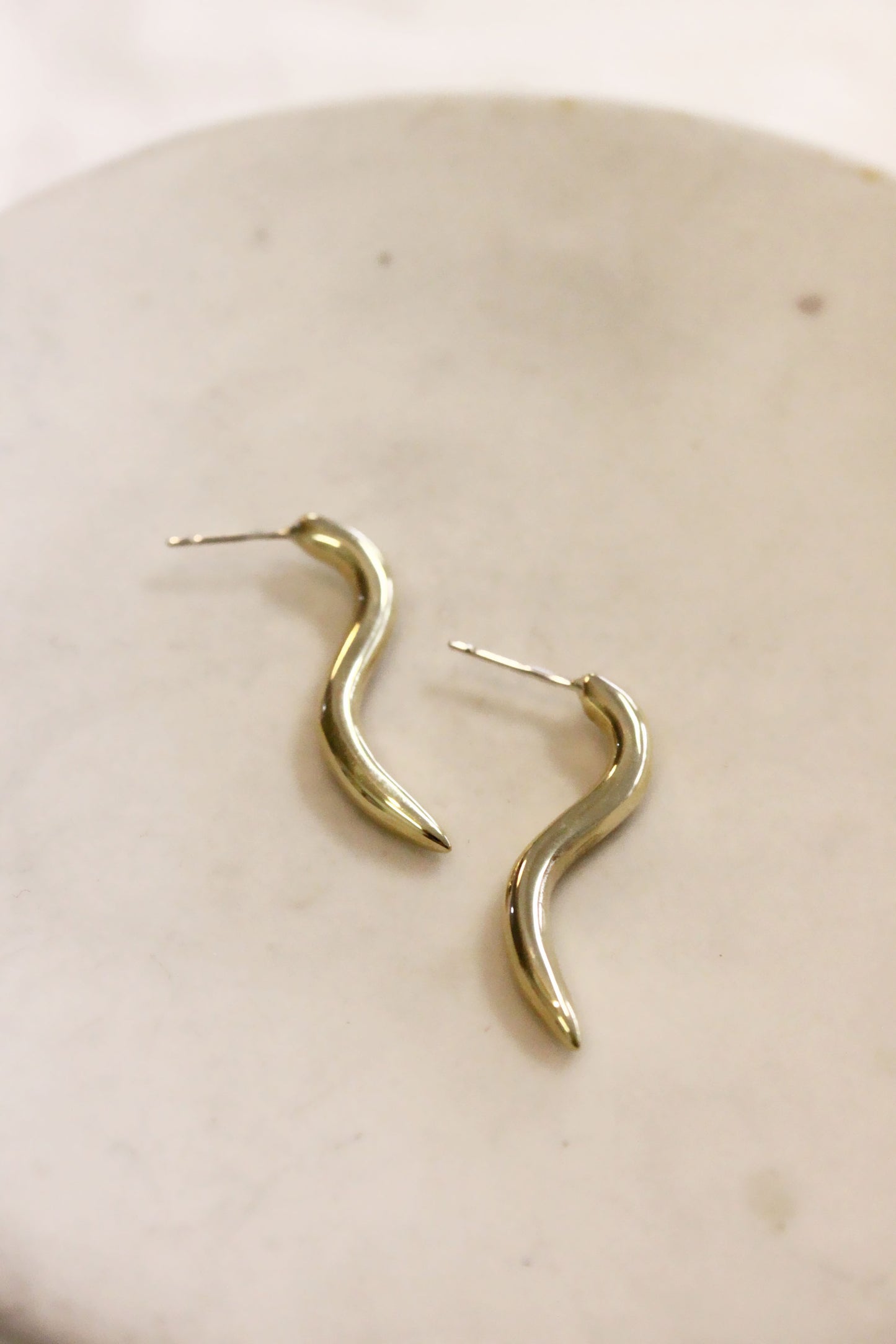 Gold curved earrings 