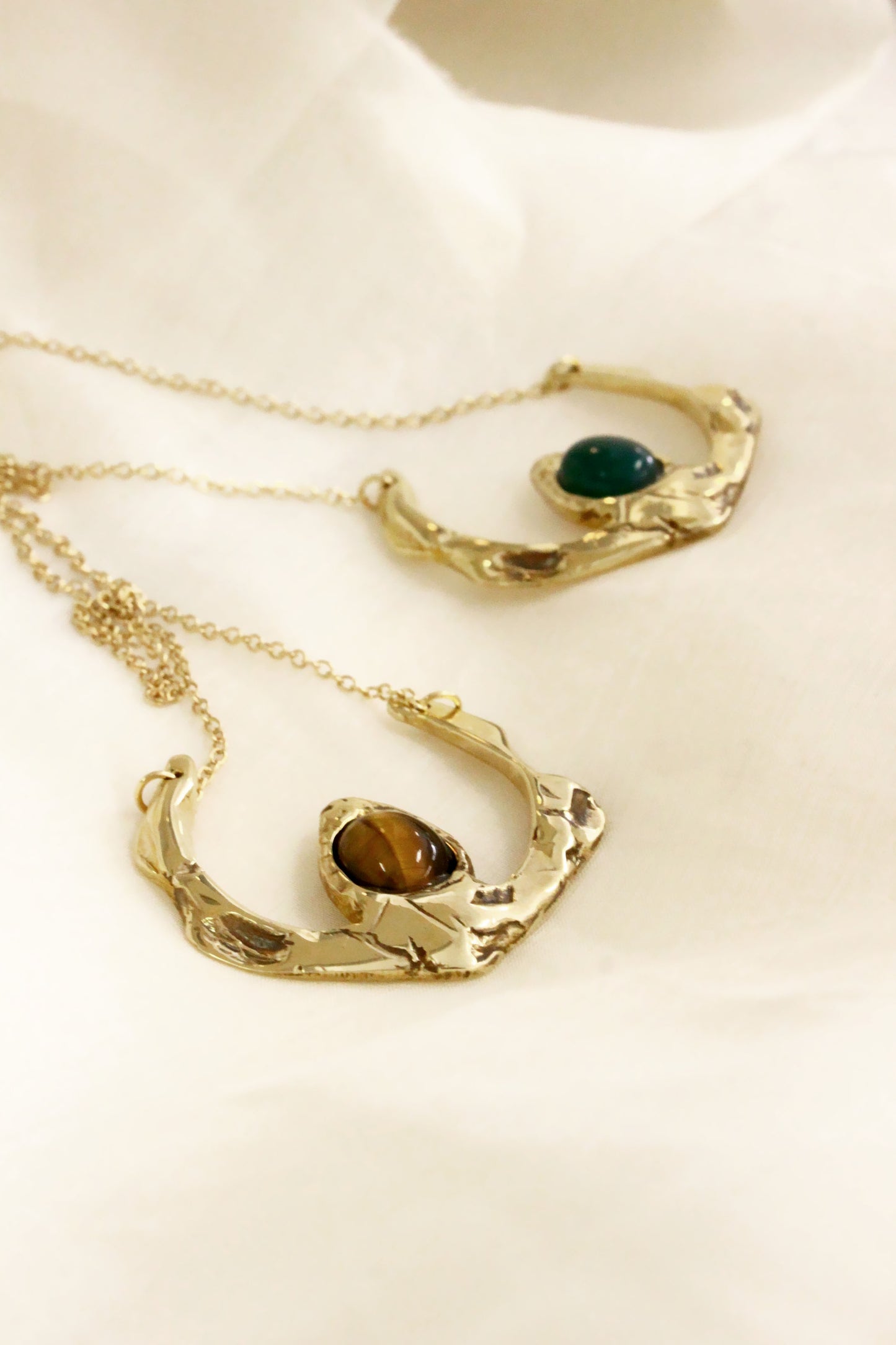 Gold necklaces with gemstones