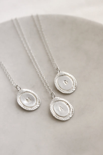 Silver necklaces with circular  personalized initials monogram 