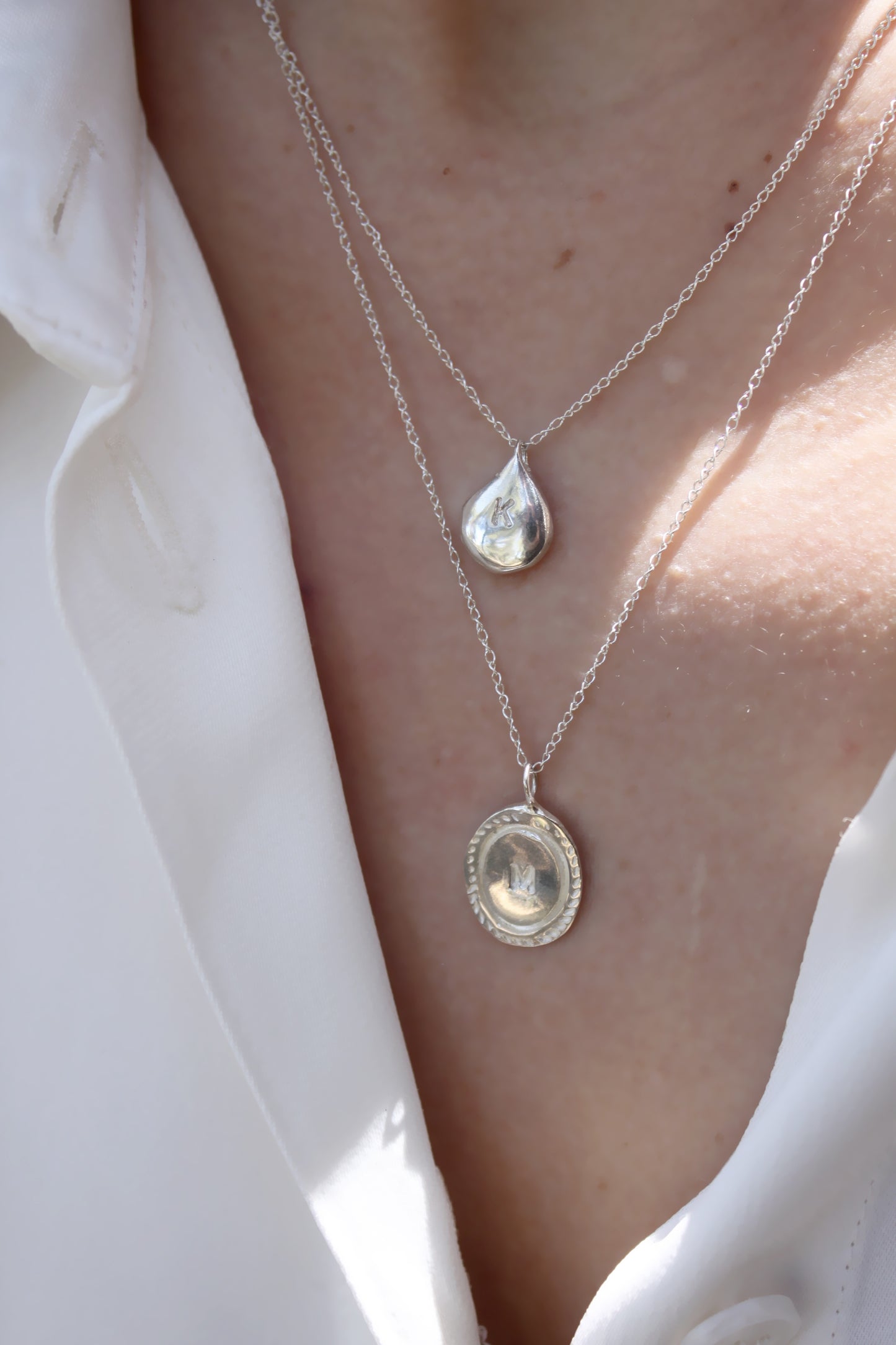 two silver necklaces with  personalized initials monogram 