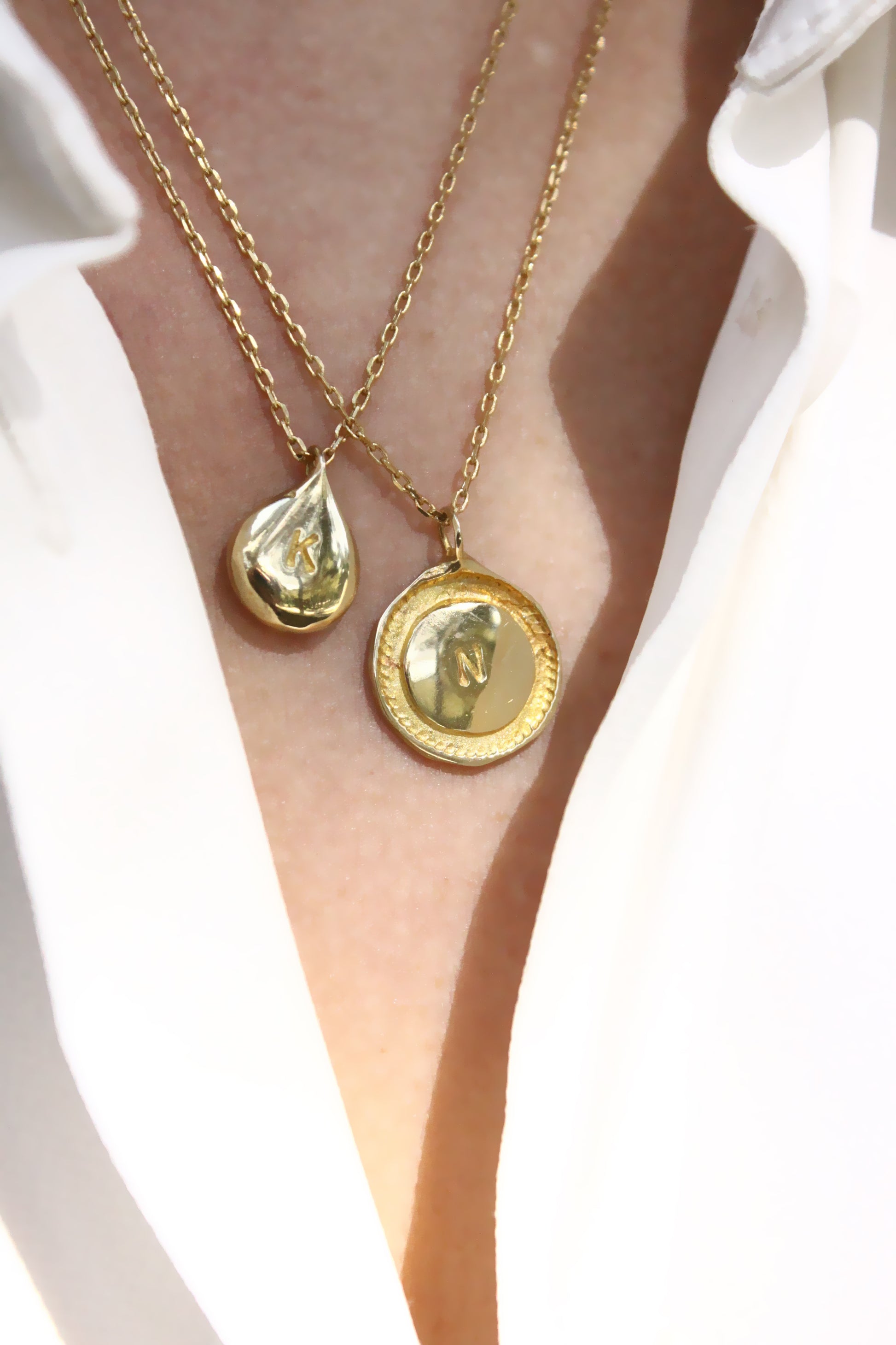 Two gold necklaces with personalized initials monogram 