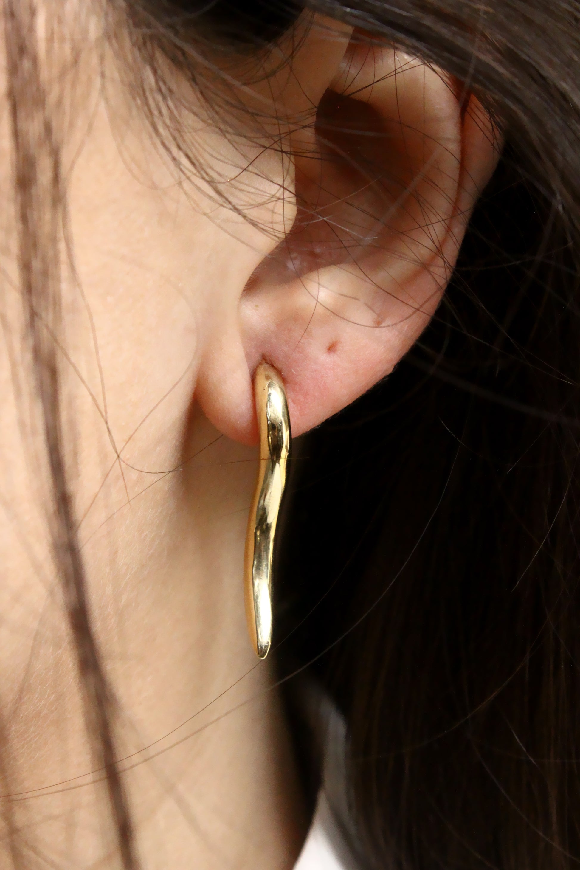Gold horn earring 