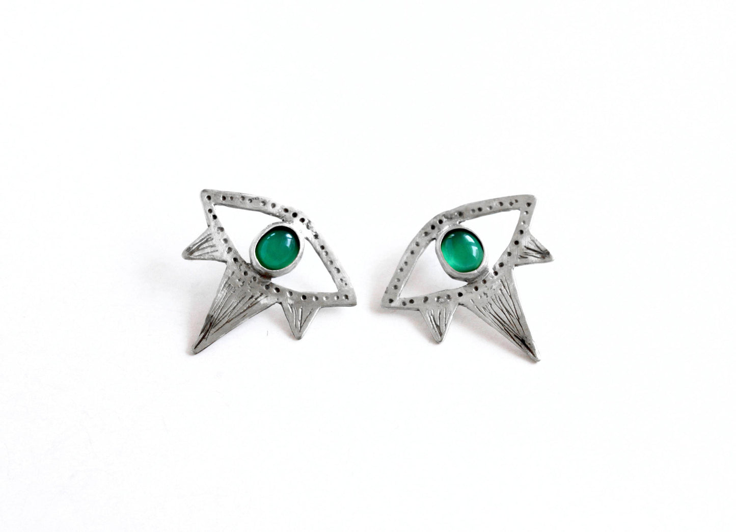Pair of silver eyes earrings with green gemstones