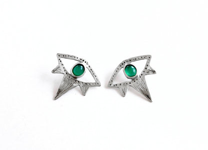 Pair of silver eyes earrings with green gemstones