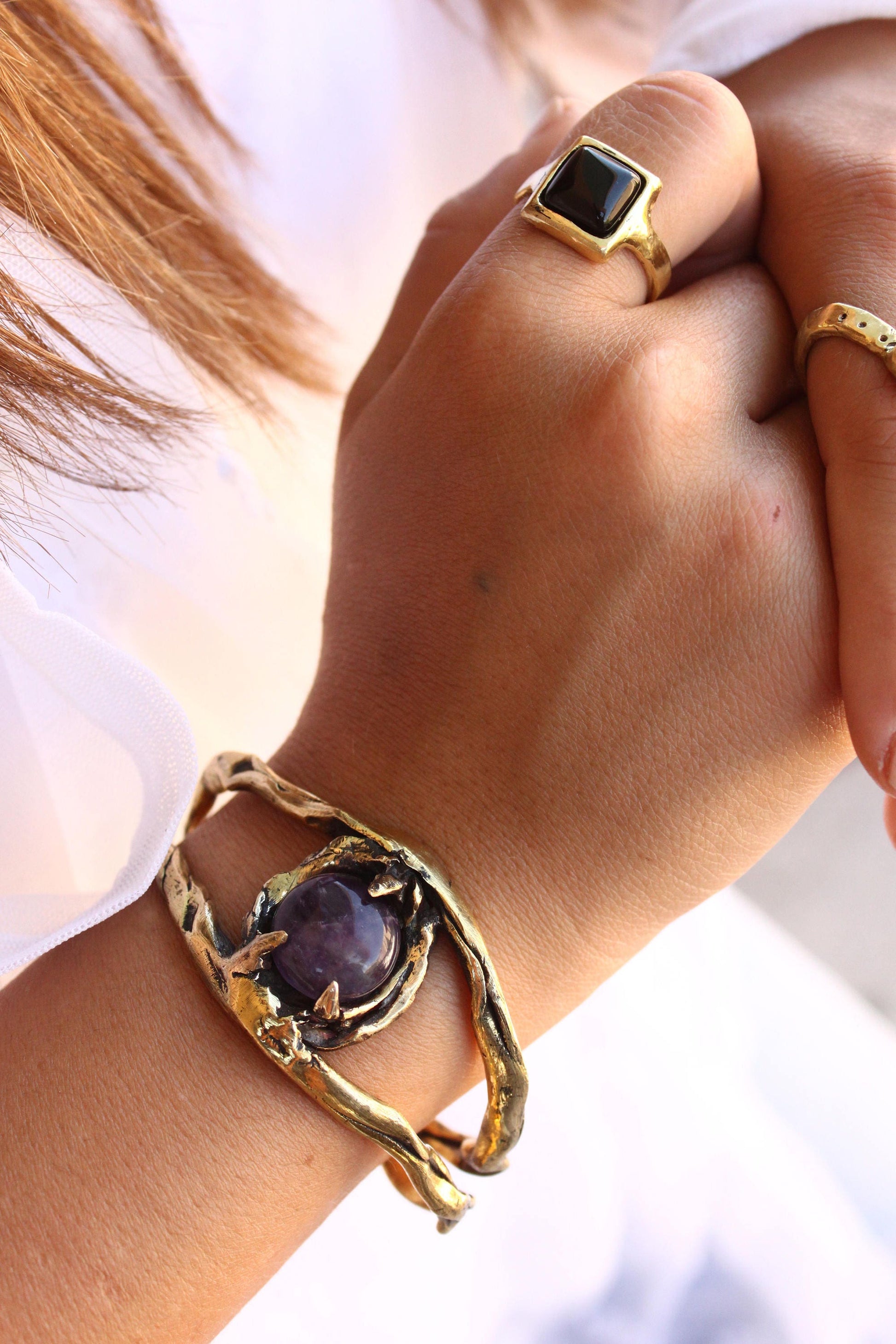 Gold bracelet and ring with purple stones 