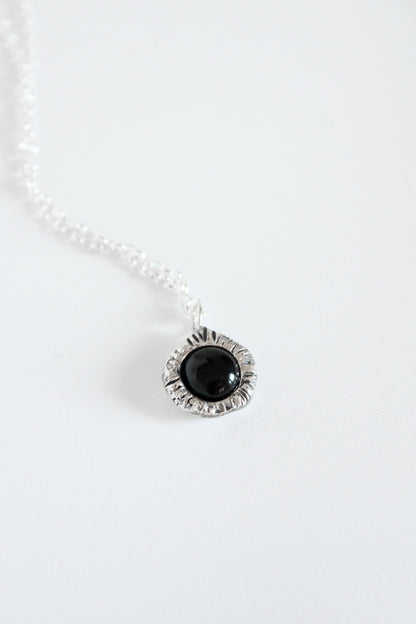 Necklace with a black onyx crystal pendant