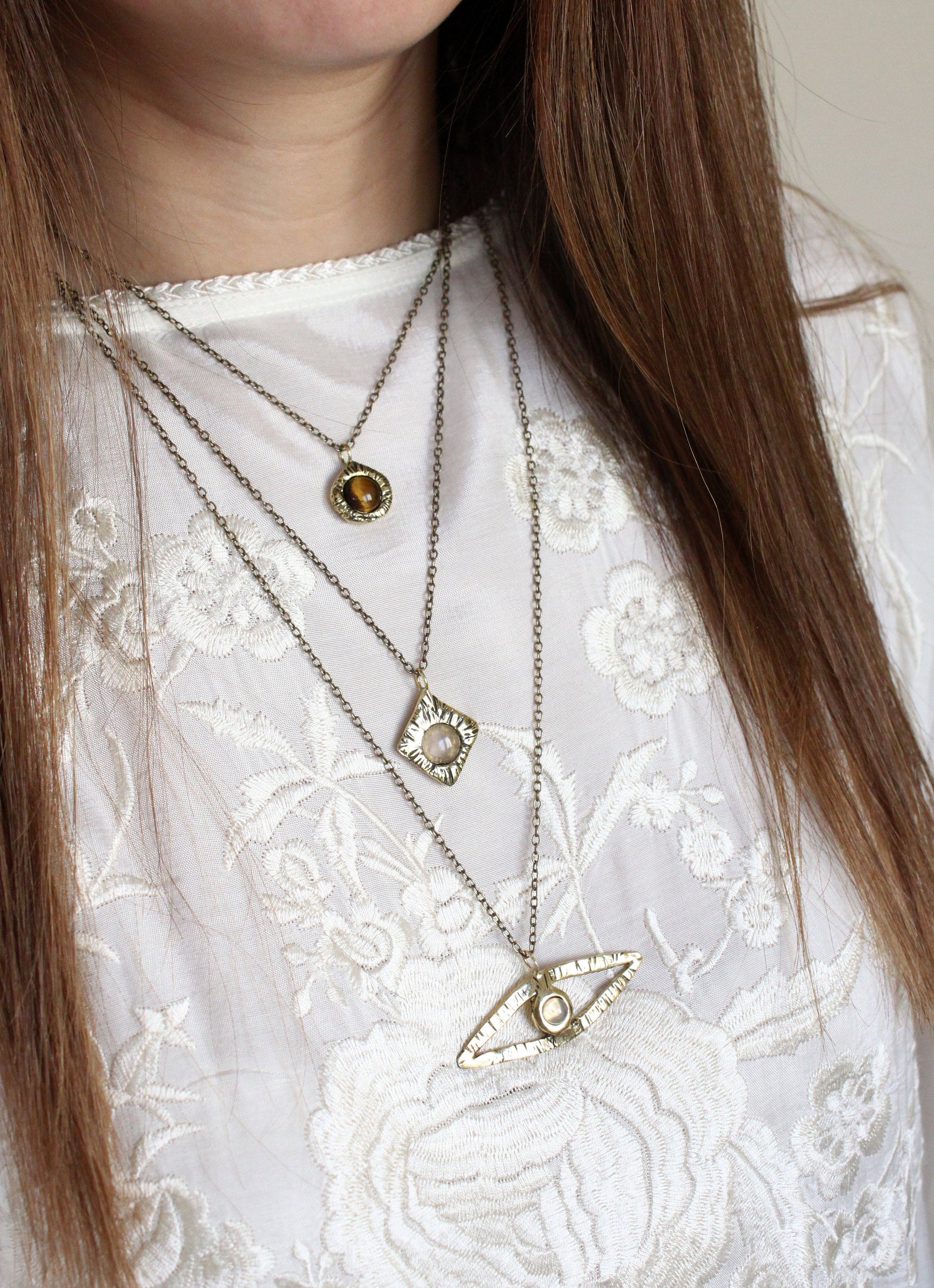 Crystal pendants with moonstone, tigers eye. 