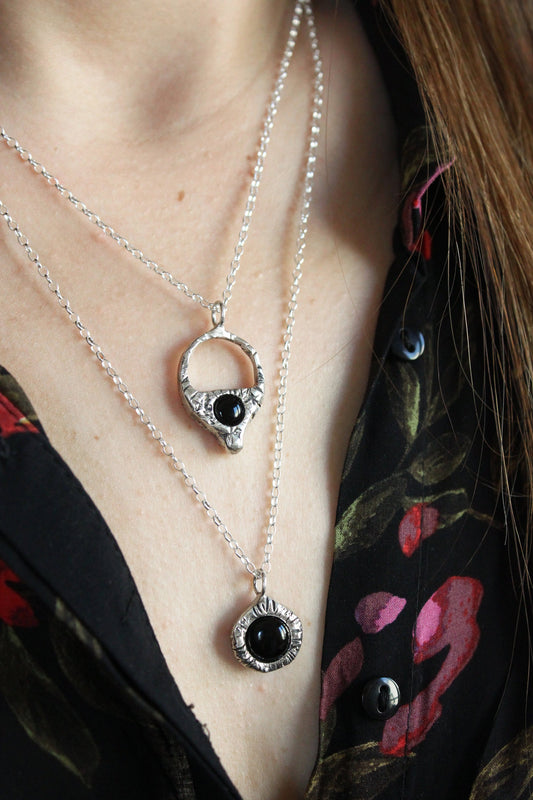 Silver necklaces with black onyx stones