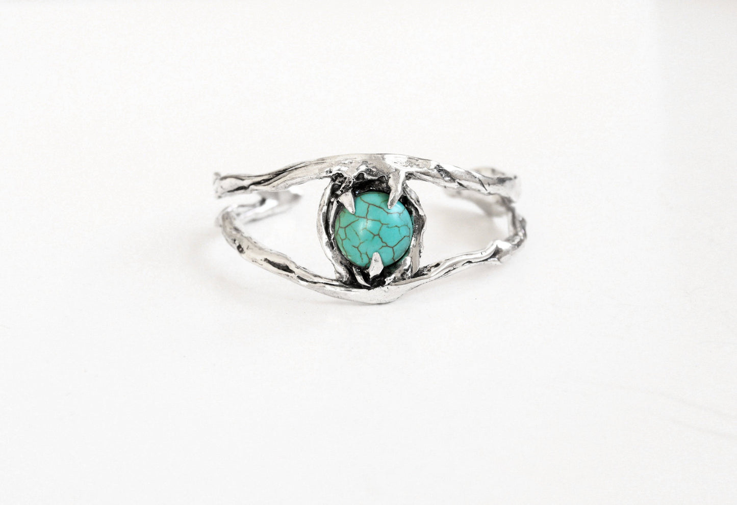 Silver cuff bracelet with a turquoise stone