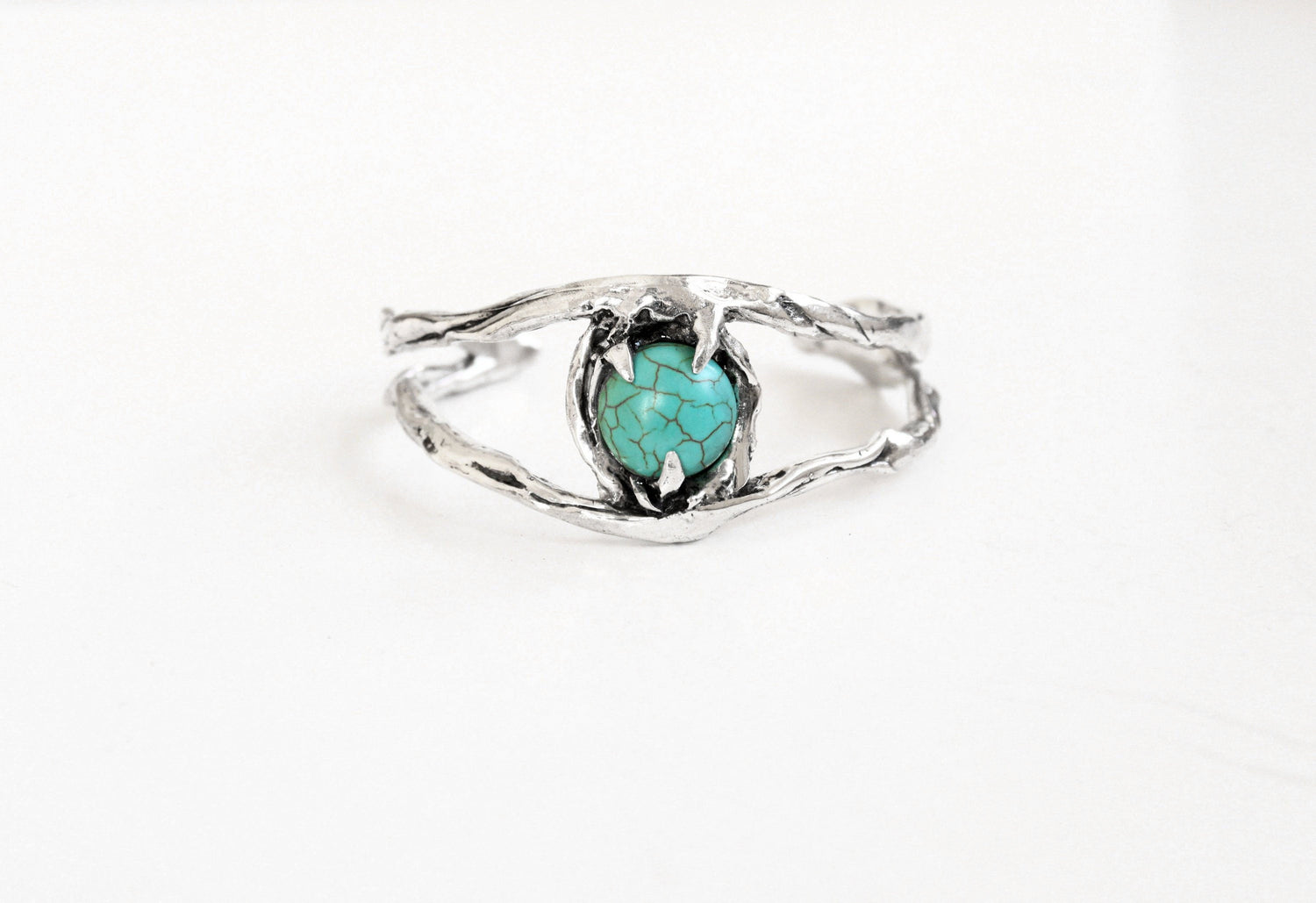 Silver cuff bracelet with a turquoise stone