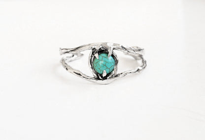 Silver cuff bracelet with a turquoise stone